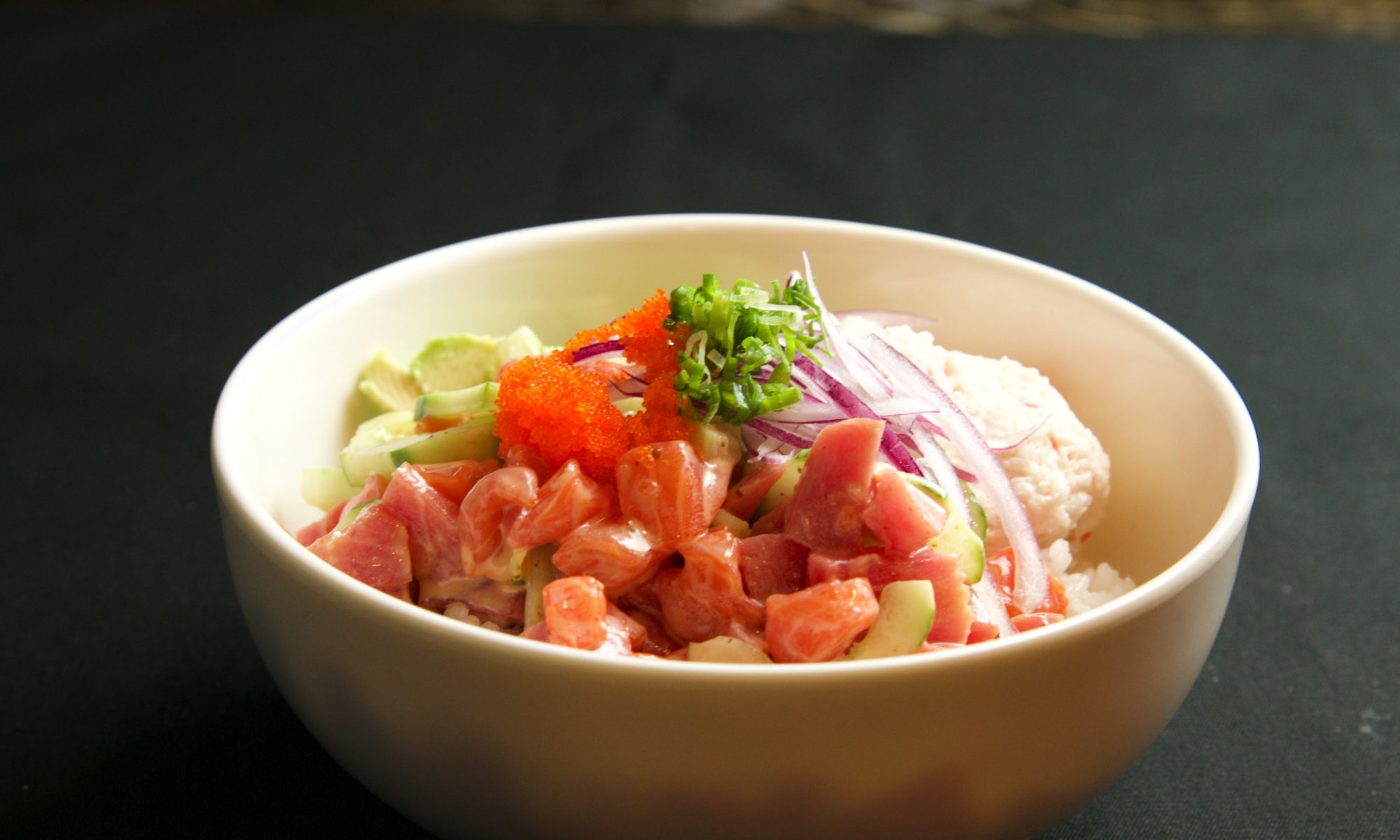 poke bowl side view of poke, rice, avocado,